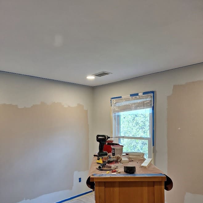 Recessed lighting installation in bedroom ceiling